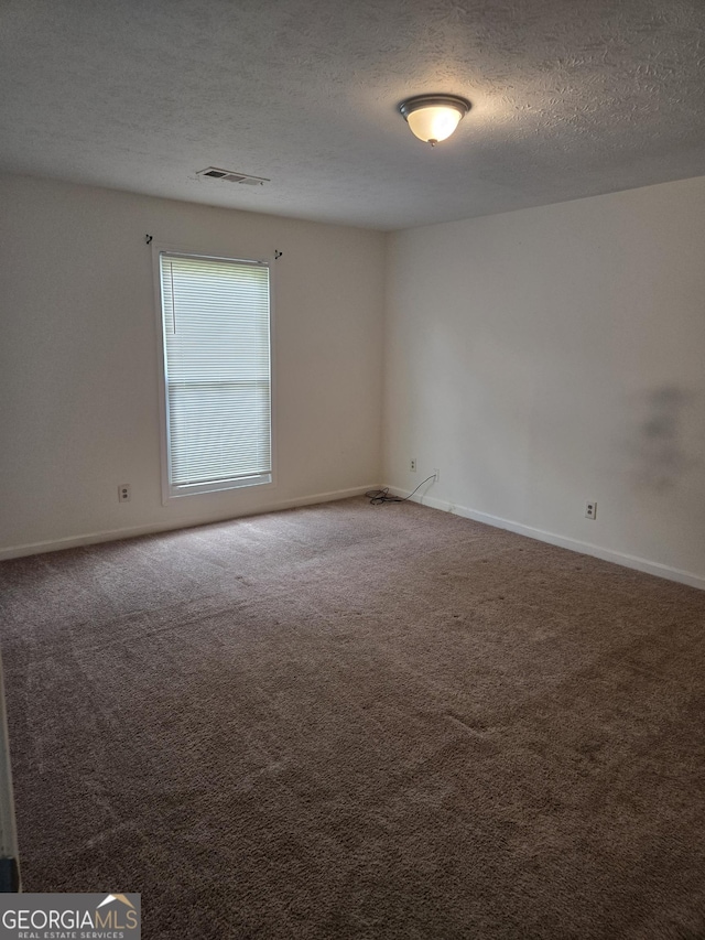 2985 Garnet Way S, Fulton, GA 30349 - spare room with a textured ceiling and carpet flooring