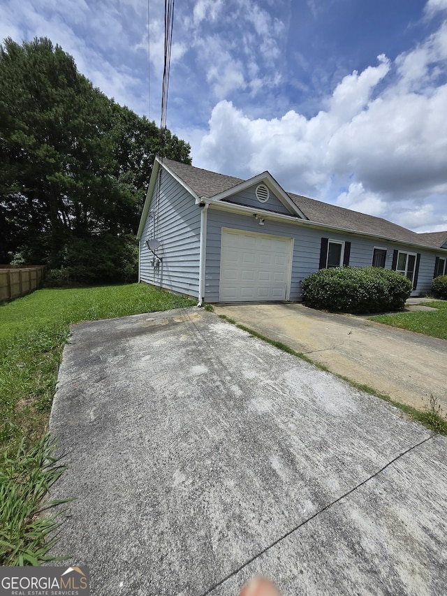2985 Garnet Way S, Fulton, GA 30349 - view of front facade featuring an attached garage, a front lawn, and driveway