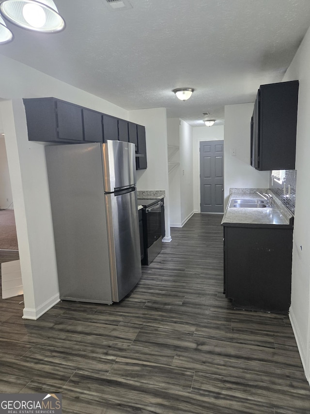2985 Garnet Way S, Fulton, GA 30349 - kitchen featuring stainless steel appliances, dark wood-style flooring, and light countertops
