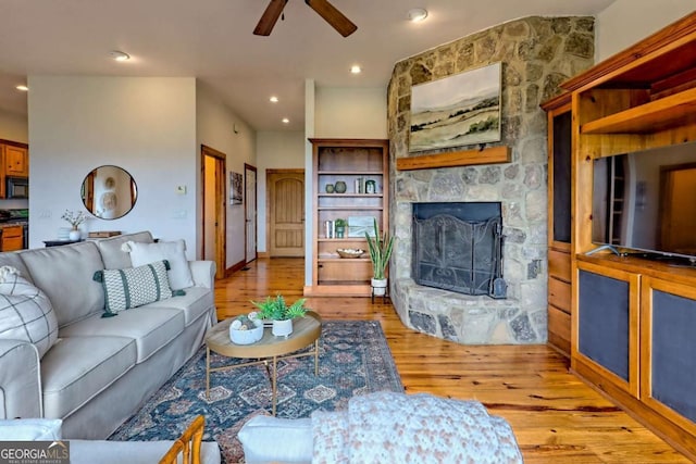 990 Hickory Nut Mountain Rd, Tallulah Falls, GA 30573 - living area featuring light wood-style floors, a ceiling fan, a stone fireplace, and recessed lighting