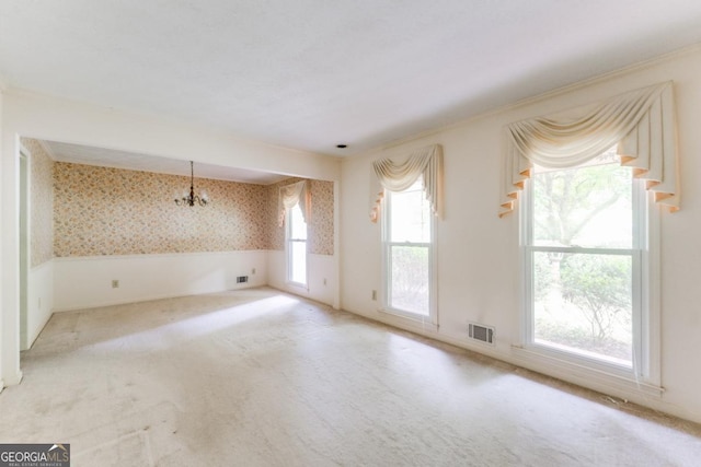 4714 Darlene Way, Tucker, GA 30084 - spare room with wallpapered walls, a chandelier, carpet floors, and a wainscoted wall
