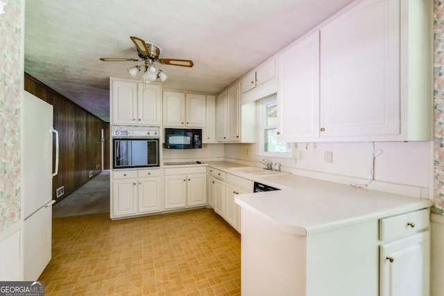 4714 Darlene Way, Tucker, GA 30084 - kitchen with black appliances, ceiling fan, a peninsula, and light countertops