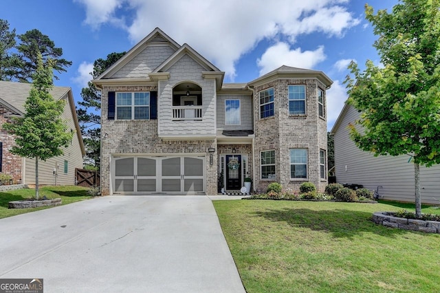 2410 Melton Common Dr, Dacula, GA 30019 - view of front facade featuring concrete driveway, a front lawn, a garage, and brick siding