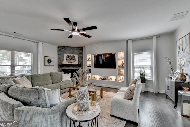 2410 Melton Common Dr, Dacula, GA 30019 - living room featuring ceiling fan, wood finished floors, and a fireplace