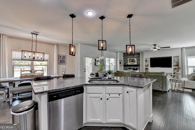 2410 Melton Common Dr, Dacula, GA 30019 - kitchen with dishwasher, healthy amount of natural light, a ceiling fan, and dark stone countertops