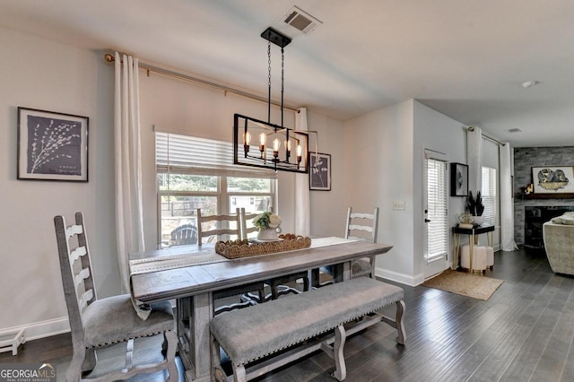 2410 Melton Common Dr, Dacula, GA 30019 - dining space featuring a chandelier and dark wood-type flooring