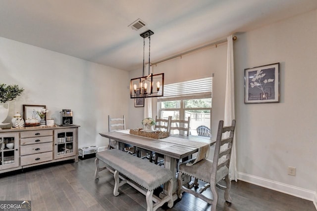 2410 Melton Common Dr, Dacula, GA 30019 - dining area featuring a chandelier and dark wood-type flooring