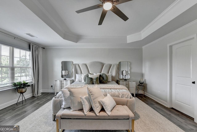 2410 Melton Common Dr, Dacula, GA 30019 - bedroom with a tray ceiling, crown molding, wood finished floors, and a ceiling fan