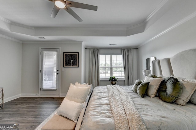 2410 Melton Common Dr, Dacula, GA 30019 - bedroom with wood finished floors, a raised ceiling, ornamental molding, ceiling fan, and access to outside