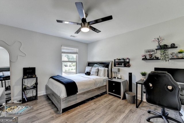 2410 Melton Common Dr, Dacula, GA 30019 - bedroom featuring an office area, light wood-style flooring, and a ceiling fan