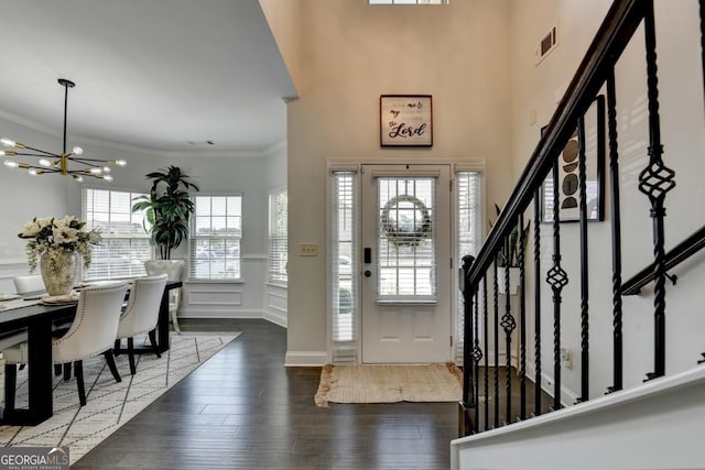 2410 Melton Common Dr, Dacula, GA 30019 - entryway featuring a chandelier, wood finished floors, stairs, and crown molding