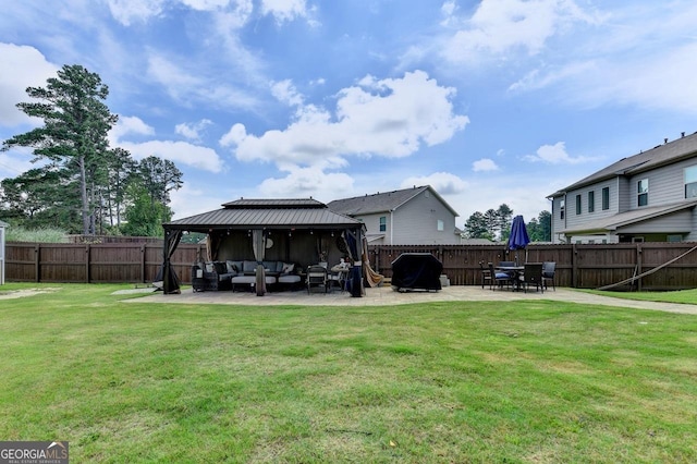2410 Melton Common Dr, Dacula, GA 30019 - rear view of house featuring an outdoor hangout area, a gazebo, a patio area, and a fenced backyard