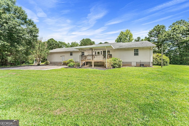 665 Center Of The World Rd, Canon, GA 30520 - back of property with a lawn and crawl space