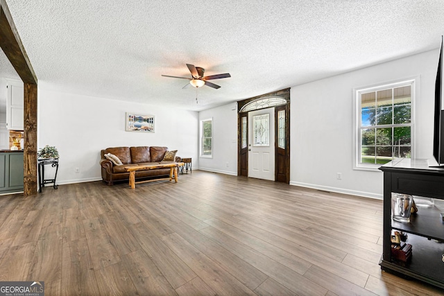 665 Center Of The World Rd, Canon, GA 30520 - living area featuring ceiling fan, a textured ceiling, and wood finished floors