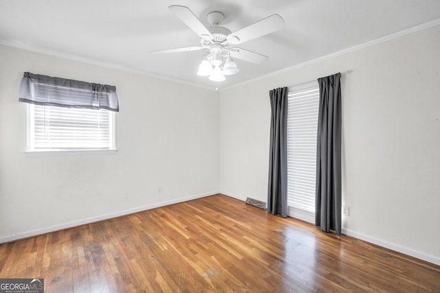 105 Skyline Dr, Barnesville, GA 30204 - spare room featuring plenty of natural light, ornamental molding, and wood finished floors