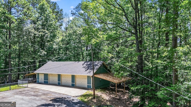 352 Grayson Trl, Hogansville, GA 30230 - view of front of house with a shingled roof and a detached garage