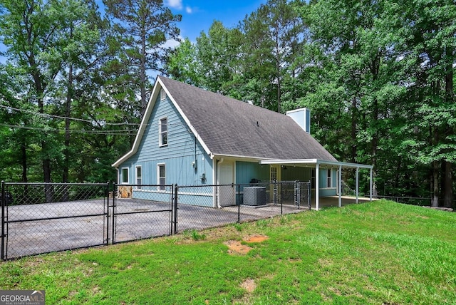 352 Grayson Trl, Hogansville, GA 30230 - view of side of property with a gate, a chimney, and a shingled roof