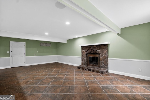 352 Grayson Trl, Hogansville, GA 30230 - unfurnished living room featuring a stone fireplace, recessed lighting, and beamed ceiling