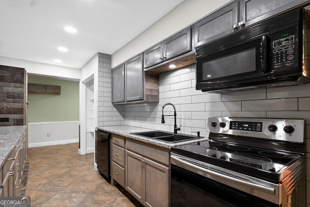352 Grayson Trl, Hogansville, GA 30230 - kitchen featuring black appliances, backsplash, dark stone finish flooring, light stone counters, and recessed lighting