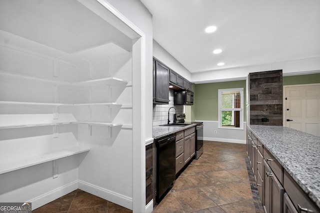 352 Grayson Trl, Hogansville, GA 30230 - kitchen with black appliances, tasteful backsplash, light stone countertops, recessed lighting, and stone tile flooring