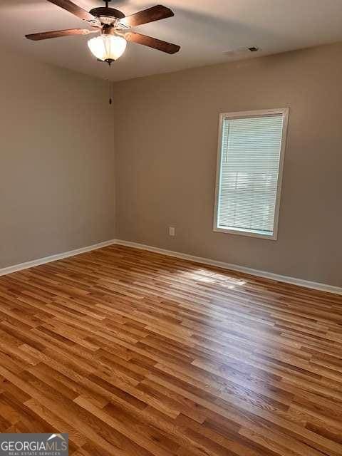 519 Roy St SW, Atlanta, GA 30310 - unfurnished room with wood finished floors and a ceiling fan