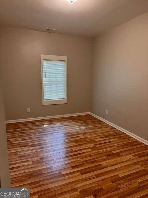 519 Roy St SW, Atlanta, GA 30310 - spare room featuring baseboards and wood finished floors