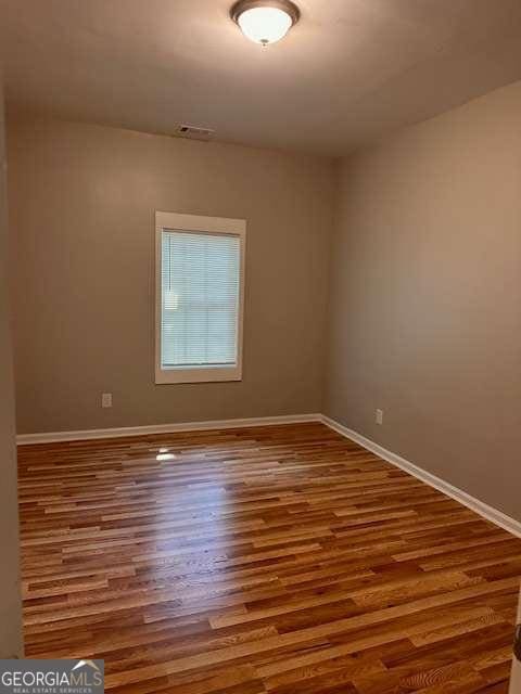 519 Roy St SW, Atlanta, GA 30310 - unfurnished room with baseboards and wood finished floors
