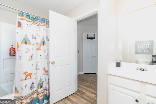 183 Venture Path, Hiram, GA 30141 - bathroom with wood finished floors, vanity, and shower / tub combo with curtain