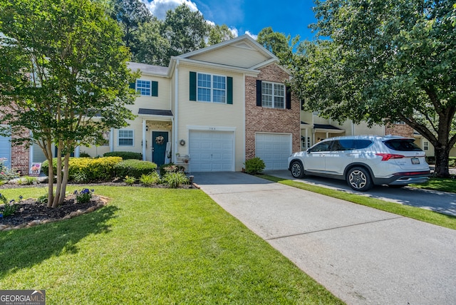 183 Venture Path, Hiram, GA 30141 - multi unit property featuring concrete driveway, a garage, a front lawn, and brick siding
