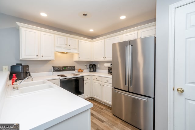 183 Venture Path, Hiram, GA 30141 - kitchen featuring freestanding refrigerator, white electric stove, under cabinet range hood, light wood-style floors, and white cabinets
