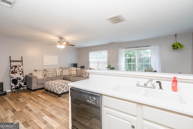 183 Venture Path, Hiram, GA 30141 - kitchen with black dishwasher, ceiling fan, light wood-style flooring, white cabinets, and open floor plan