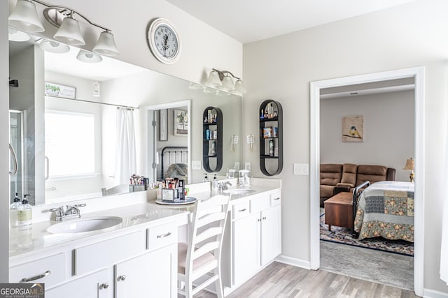 107 Topaz St, Calhoun, GA 30701 - ensuite bathroom with wood finished floors, double vanity, and a shower with curtain