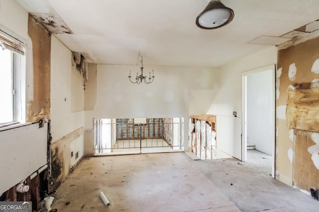 2571 Beech St, Morrow, GA 30260 - empty room with healthy amount of natural light and a chandelier