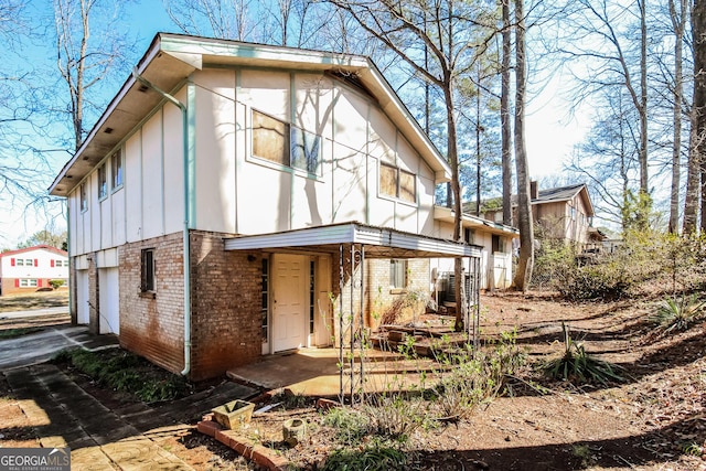 2571 Beech St, Morrow, GA 30260 - rear view of house with brick siding and board and batten siding