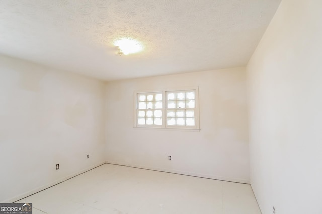 2571 Beech St, Morrow, GA 30260 - unfurnished room with a textured ceiling and baseboards