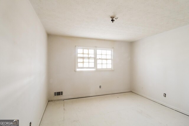 2571 Beech St, Morrow, GA 30260 - unfurnished room with a textured ceiling