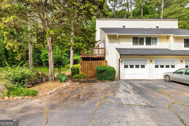 44 Twiggs Cor, Peachtree City, GA 30269 - view of front of property featuring driveway, an attached garage, and view of scattered trees