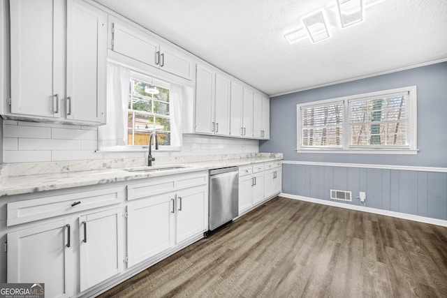 2511 Due W Cir NW, Kennesaw, GA 30152 - kitchen with dishwasher, wood finished floors, white cabinets, tasteful backsplash, and a textured ceiling
