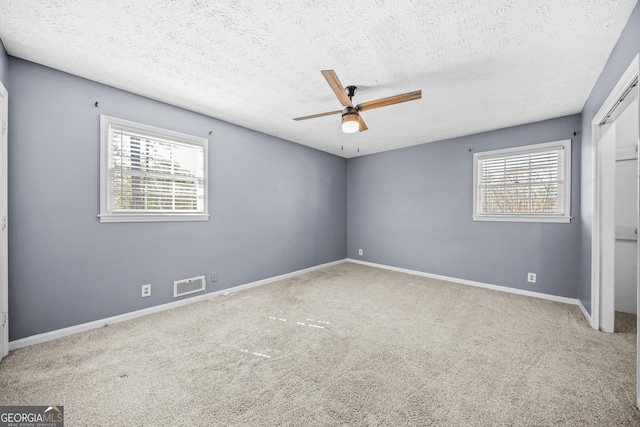 2511 Due W Cir NW, Kennesaw, GA 30152 - carpeted spare room with a ceiling fan and a textured ceiling