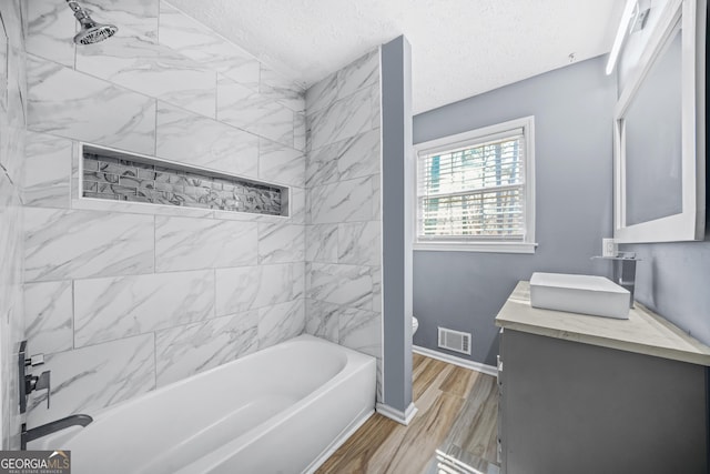 2511 Due W Cir NW, Kennesaw, GA 30152 - full bath with vanity, bathtub / shower combination, a textured ceiling, and wood finished floors