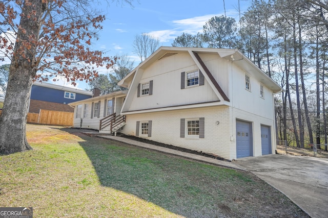 2511 Due W Cir NW, Kennesaw, GA 30152 - view of property exterior with a garage, brick siding, and concrete driveway