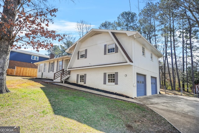 2511 Due W Cir NW, Kennesaw, GA 30152 - view of property exterior featuring an attached garage, brick siding, and driveway