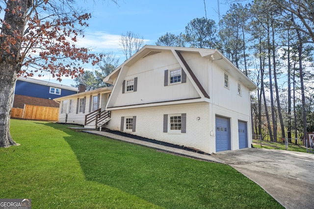 2511 Due W Cir NW, Kennesaw, GA 30152 - view of side of home with an attached garage, brick siding, and driveway