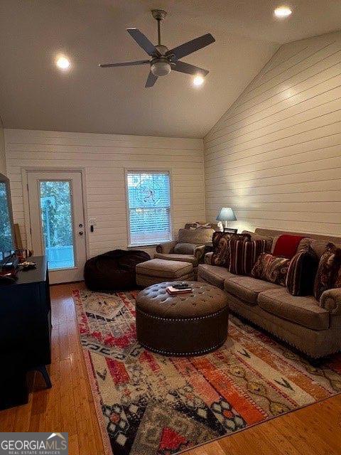 324 Moss Creek Ln, Brunswick, GA 31520 - living room featuring wood-type flooring, ceiling fan, vaulted ceiling, wood walls, and recessed lighting