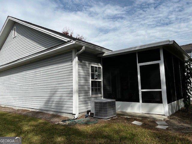 324 Moss Creek Ln, Brunswick, GA 31520 - view of side of property with a sunroom