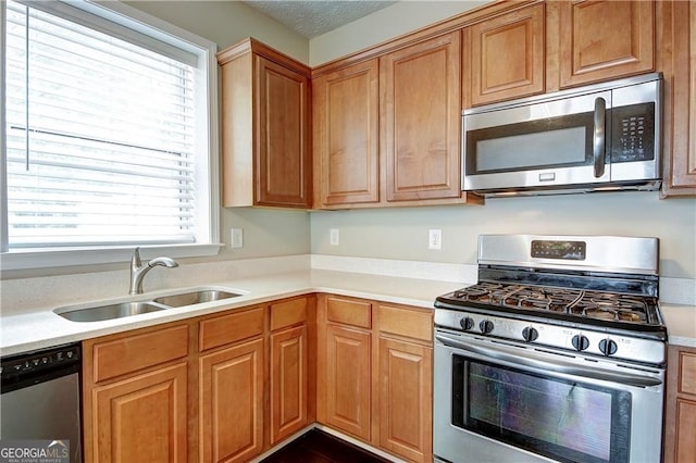 1643 Jackson Way, Atlanta, GA 30318 - kitchen with appliances with stainless steel finishes, light countertops, and brown cabinets