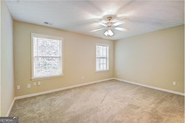 1643 Jackson Way, Atlanta, GA 30318 - empty room featuring light carpet, a ceiling fan, and a textured ceiling