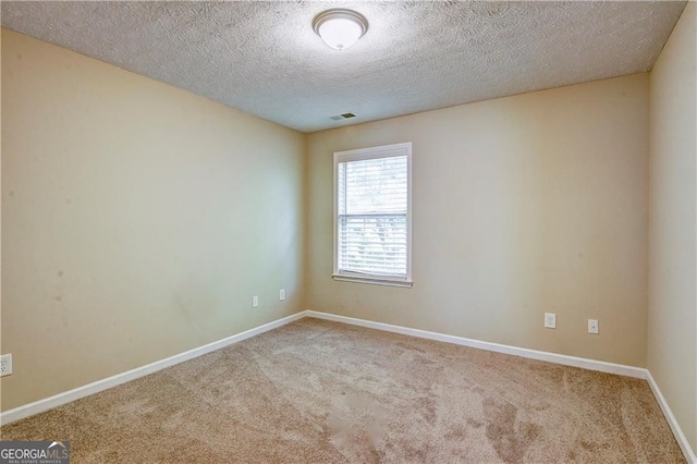 1643 Jackson Way, Atlanta, GA 30318 - carpeted spare room with baseboards and a textured ceiling