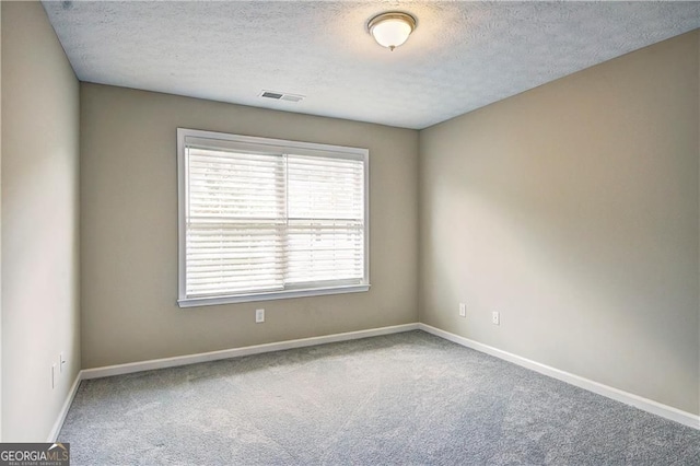 1643 Jackson Way, Atlanta, GA 30318 - empty room featuring carpet and a textured ceiling