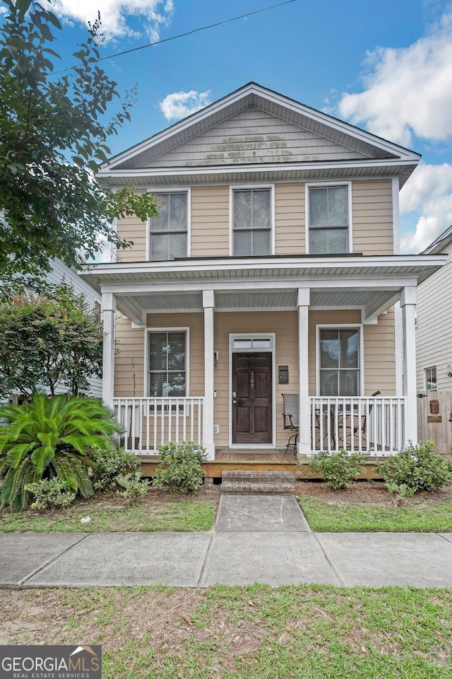 309 E 41st St, Savannah, GA 31401 - view of front facade featuring covered porch
